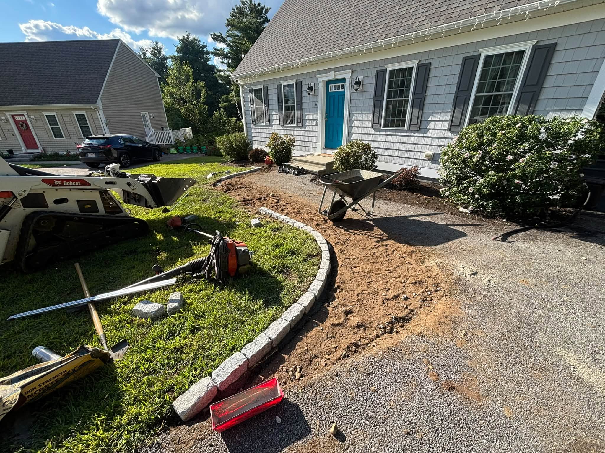 Cobblestone border installation in progress — Spencer, MA